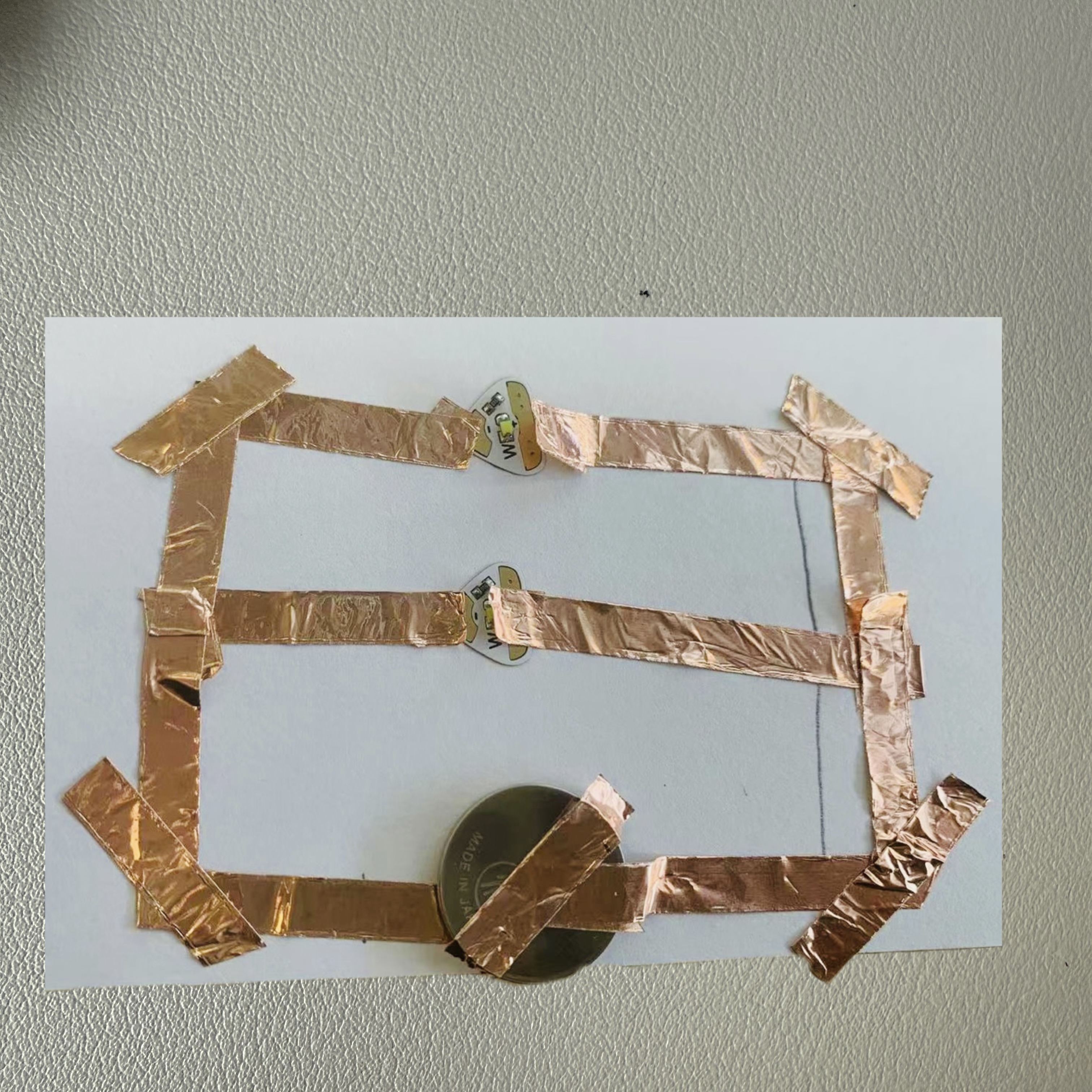 I built the parallel circuit using copper tape and LEDs, ensuring it matches my diagram.