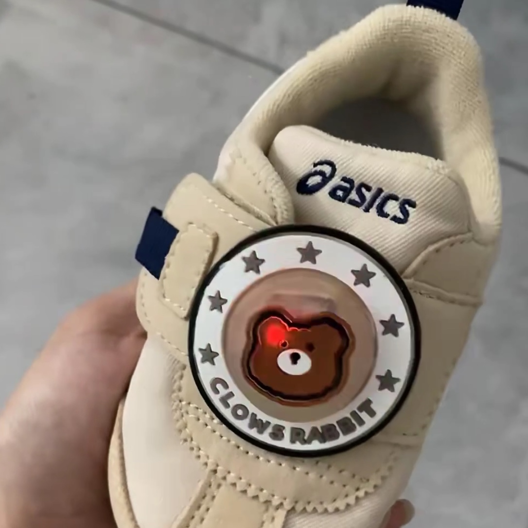 This  image is a pair of shoes from your little cousin, featuring a cute bear-shaped LED light that turns on when pressure is applied. This gave you the inspiration for your own light-up shoe design. 