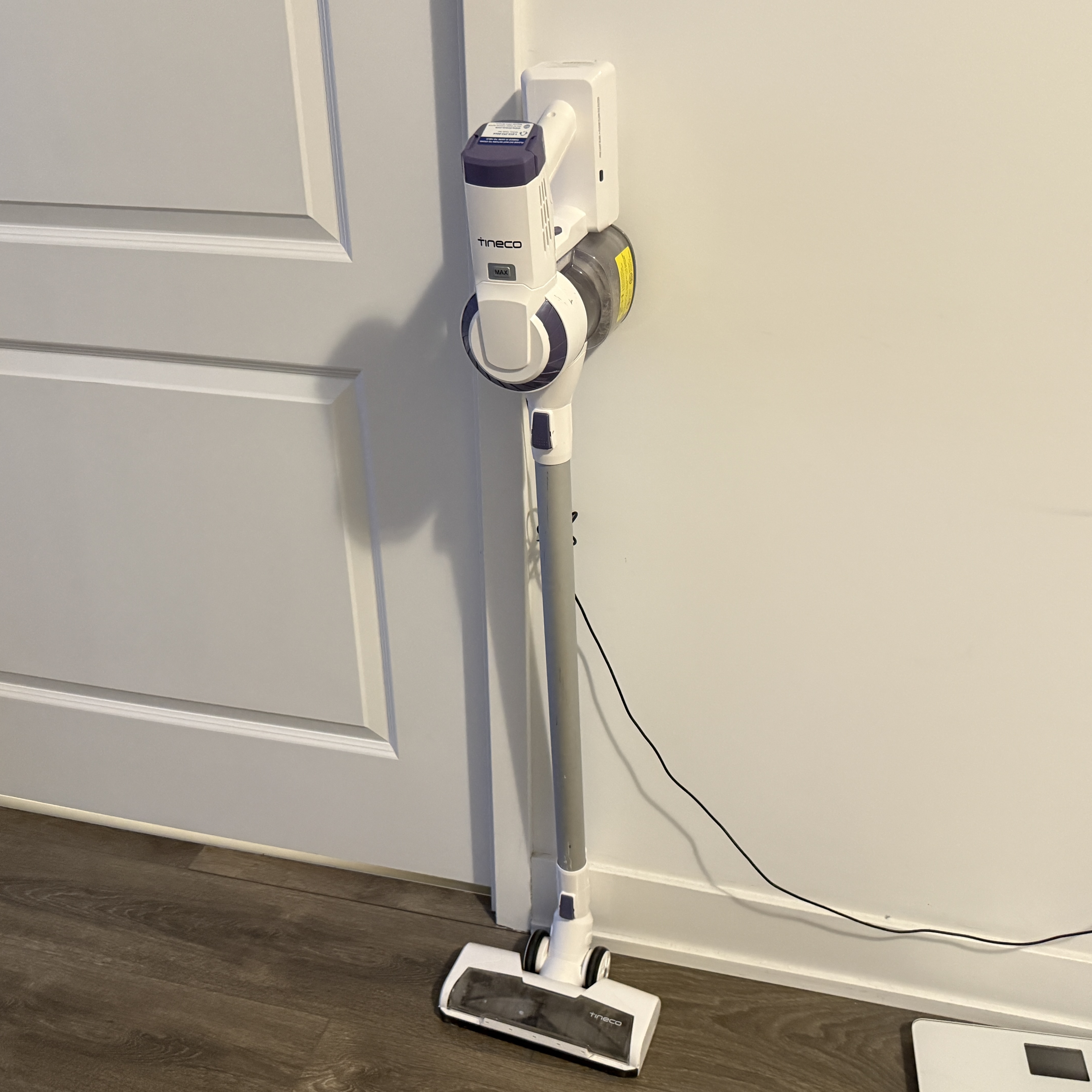 The strong suction and humming noise of a vacuum cleaner.